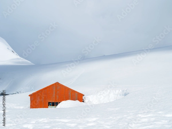 Obraz Orange red hut in deep snow