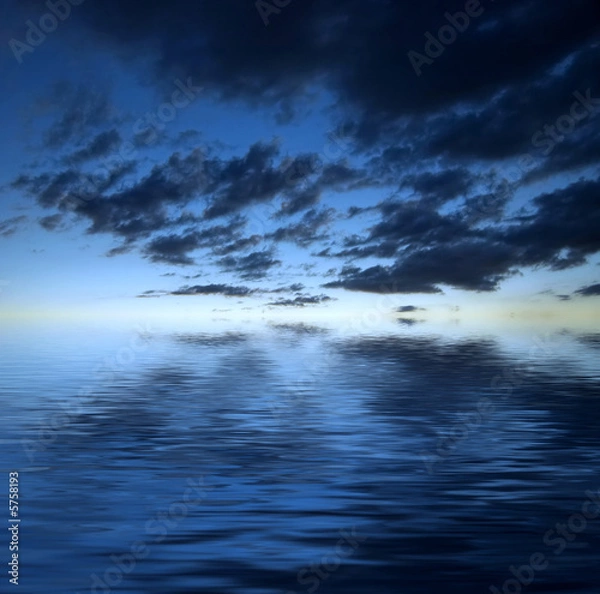 Fototapeta Dark dramatic clouds over water