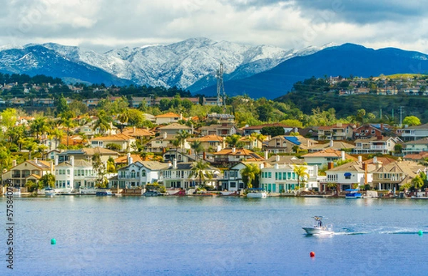 Obraz Lake Mission Viejo with snow capped Santa Ana Mountains in the distance, after epic snowstorm in Southern California