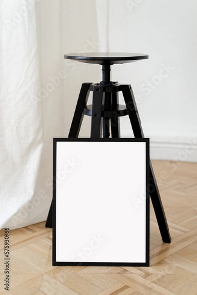 Fototapeta Vertical mockup black frame at minimalist studio interior. Frame for art work, photos and posters