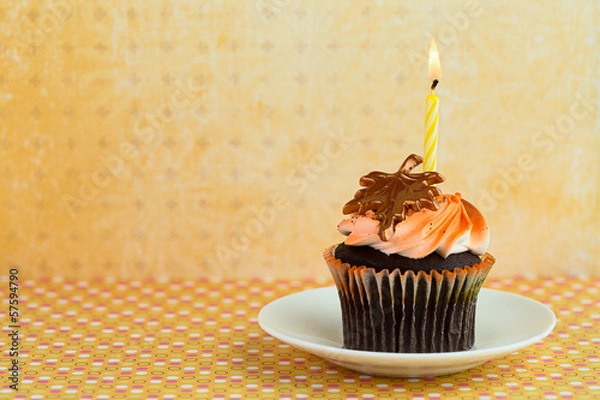 Obraz Cupcake on a Saucer with a Candle