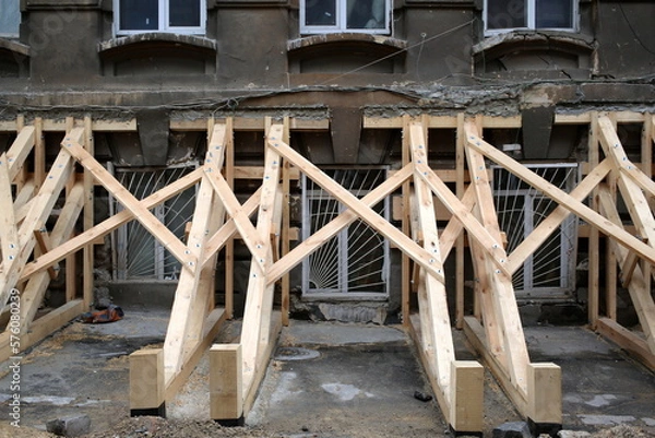 Obraz wall support on an old building facade