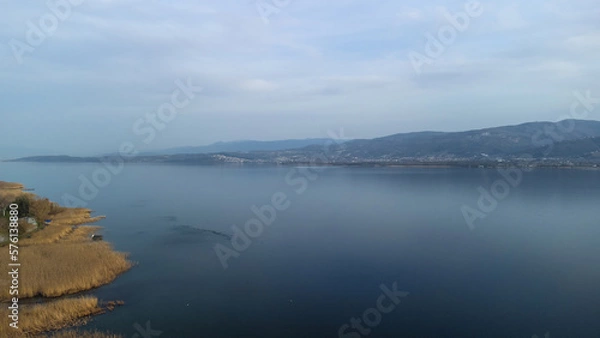 Obraz Aerial view of lake and reeds. Lake Sapanca in Turkey. Lake water level decreased due to drought. Drone view. Selective focus included. Noise and grain included.