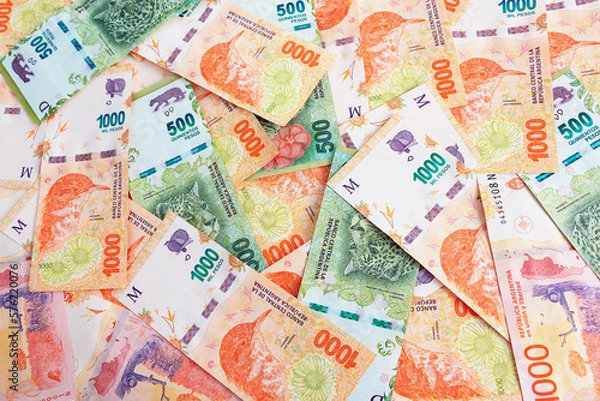 Fototapeta 1000 and 500 Argentine pesos Banknotes expanded on a surface