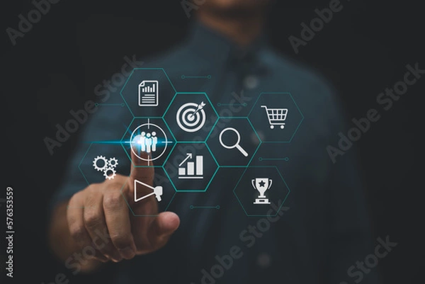 Fototapeta Target customer and buyer persona concepts in marketing strategies. Personalization and customer-centric approach emphasized. Businessman touches screen to target customer.