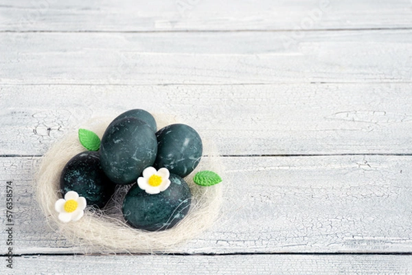 Obraz Eggs in a decorative white nest are painted for Easter celebration. Festive decor for breakfast