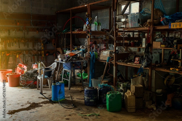 Obraz farm impliments cluttered inside a barn