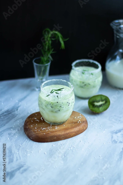 Fototapeta Milkshake with kiwi in a glass.