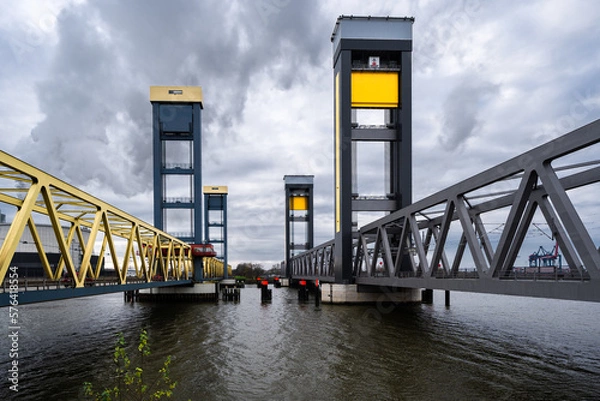 Obraz Hamburg, Germany - 11-30-2020: Kattwyk Bridge over the Elbe river in the industrial area