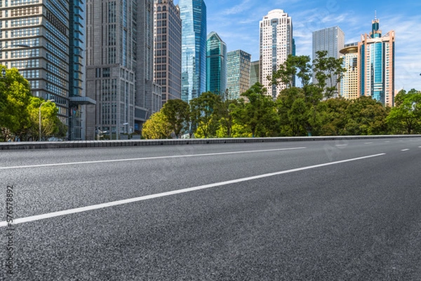 Fototapeta empty road and modern office buildings.