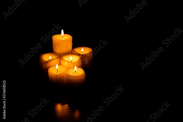 Fototapeta Set of candles on a black background with copy space. Holy Week, Good Friday, Pentecost, Religiosity and spirituality