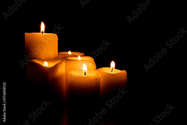 Fototapeta Set of candles on a black background with copy space. Holy Week, Good Friday, Pentecost, Religiosity and spirituality