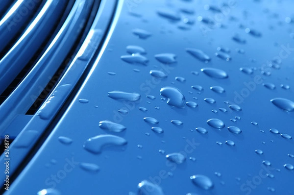 Fototapeta close-up of raindrops on metallic vehicle panel