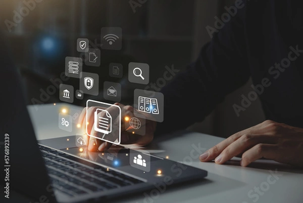 Fototapeta Businessman working on laptop with document management icon, Online document file management, database technology concept.