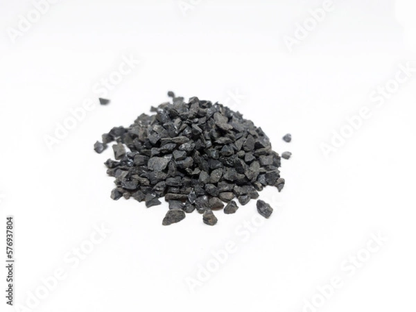 Fototapeta Anthracite commonly used in the water filtration to remove impurities and improve water quality. Anthracite known as hard black coal is acompact variety of coal. Isolated on white background