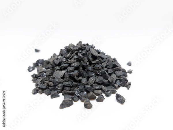 Fototapeta Anthracite commonly used in the water filtration to remove impurities and improve water quality. Anthracite known as hard black coal is acompact variety of coal. Isolated on white background