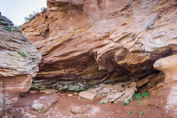 Fototapeta a large rock formation on rocky coastline, wonder of nature. waves in the process of erosion eroded the rock