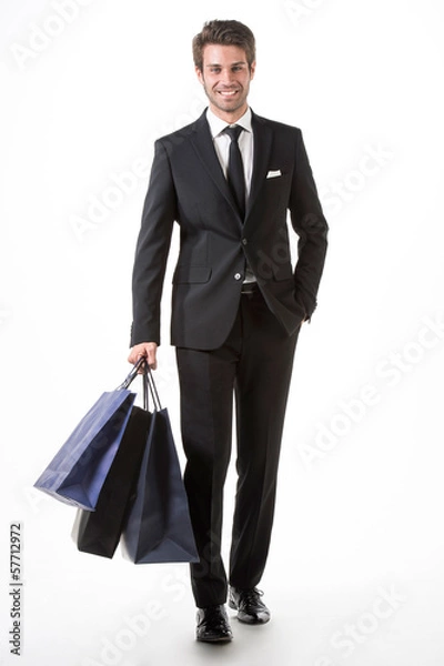 Fototapeta Uomo felice fa shopping con borse