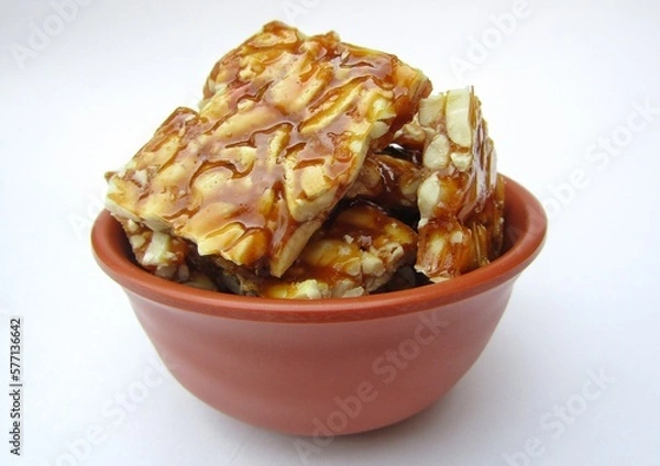 Obraz Peanut chikki bar in a bowl 