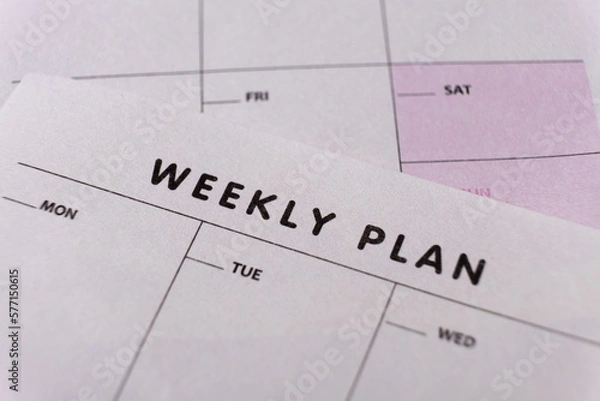 Fototapeta Weekly planner. Calendar reminder, organizer, schedule, planning concept. Close-up of weekly plan paper