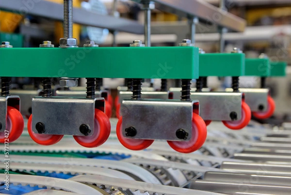 Fototapeta Colorful detail of an equipment fitted with belts and pulleys