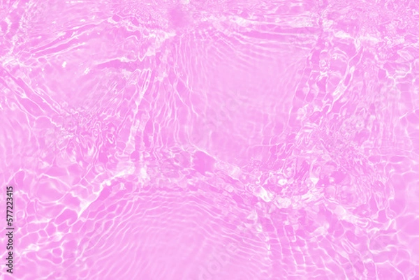 Fototapeta Defocus blurred transparent pink colored clear calm water surface texture with splashes and bubbles. Trendy abstract nature background. Water waves in sunlight with copy space. Purple watercolor shine