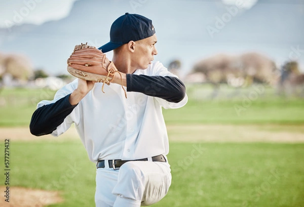 Obraz Baseball, pitcher and sports with man on field of stadium for training, practice and workout. Fitness, exercise and action with athlete throwing ball in game in park for competition, match and skill