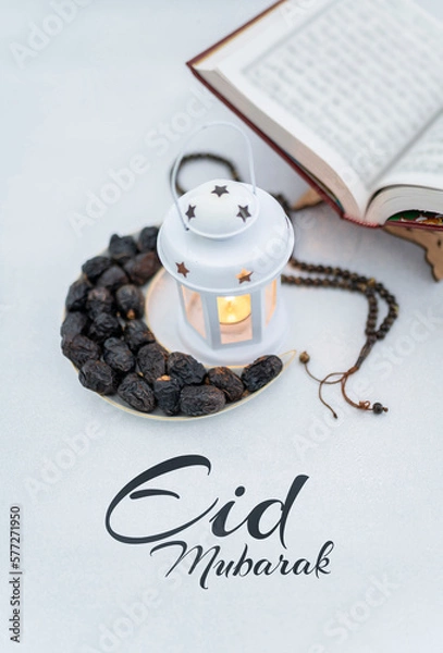 Fototapeta Iftar background dates arranged in shape of crescent moon with traditional white lantern lamp