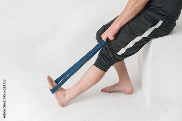 Fototapeta legs of a person. A man is doing physical exercises 