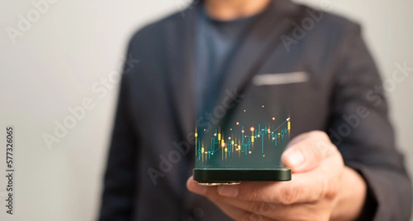 Fototapeta trading Forex, bitcoin or stock exchange concept , businessman using mobile phone and internet for investment or financial trading