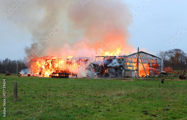 Obraz Burning farm building with hay