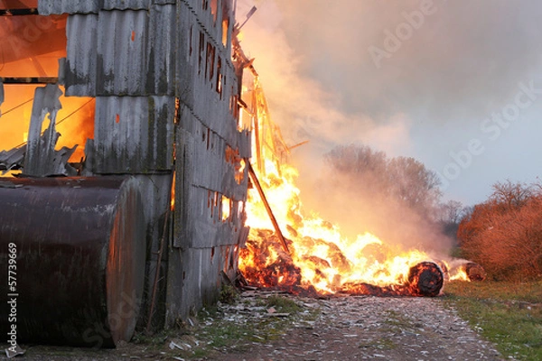 Obraz Burning farm building with hay