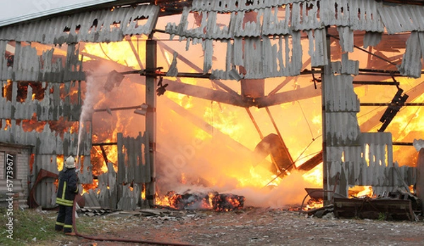 Obraz Burning farm building with hay