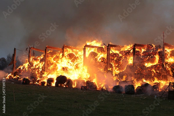 Obraz Burning farm building with hay