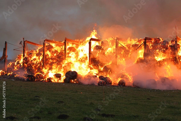 Obraz Burning farm building with hay