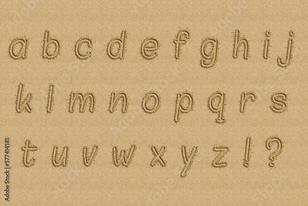 Fototapeta The alphabet written in sand on a beach.