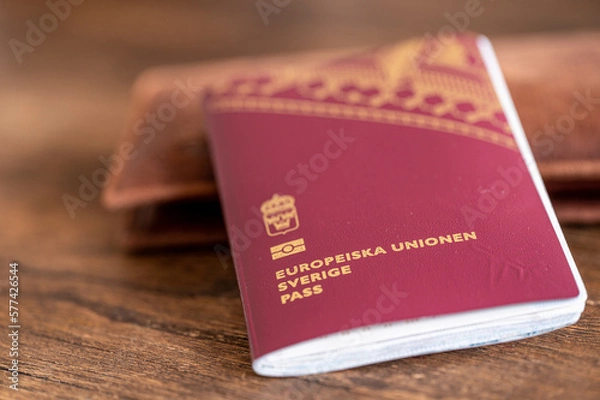 Fototapeta Close-up of a Swedish passport and a wallet for travel documents