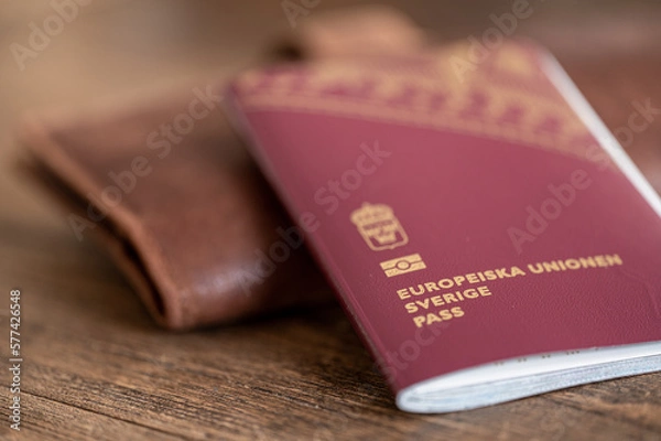 Fototapeta Close-up of a Swedish passport and a wallet for travel documents