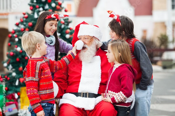 Obraz Children Playing With Santa Claus's Hat