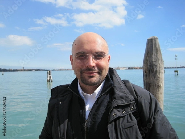 Fototapeta Venice holiday picture of a man smiling at the camera in Venice in a sunny day