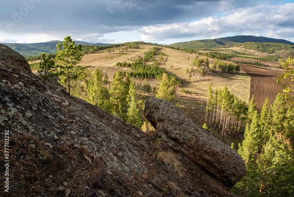 Obraz Rocks with pine trees against the sky, spring
