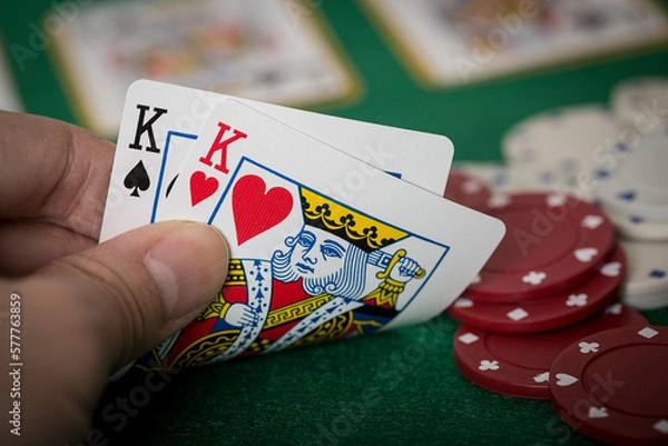 Fototapeta Closeup of hands with kings, Texas Hold'em Poker gambling concept
