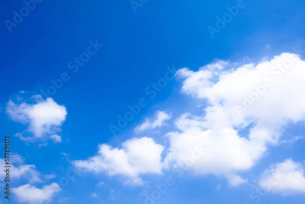 Obraz Beautiful blue sky with white fluffy clouds.