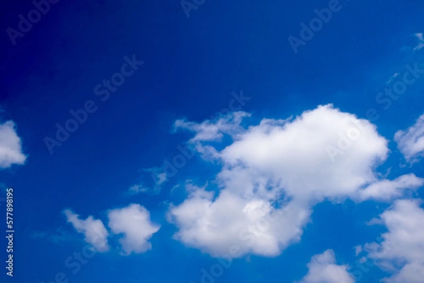 Obraz Beautiful blue sky with white fluffy clouds.