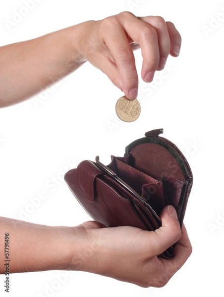 Obraz Hand puts a coin in the purse, isolated on white background