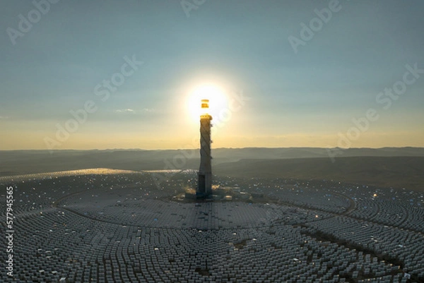 Obraz Hydroelectric Solar tower power station at sunrise in a desert landscape