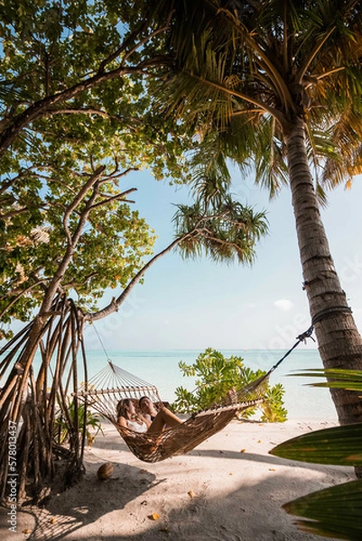 Obraz Young Couple Lying In The Hammock And Enjoying The Ocean View In Maldives