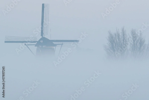 Fototapeta Dutch windmill in the mist