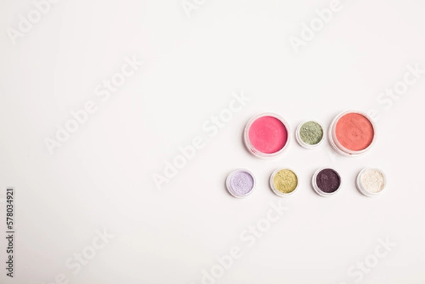 Fototapeta Many colorful natural mineral eyeshadows isolated on white background with copy space and empty space for text