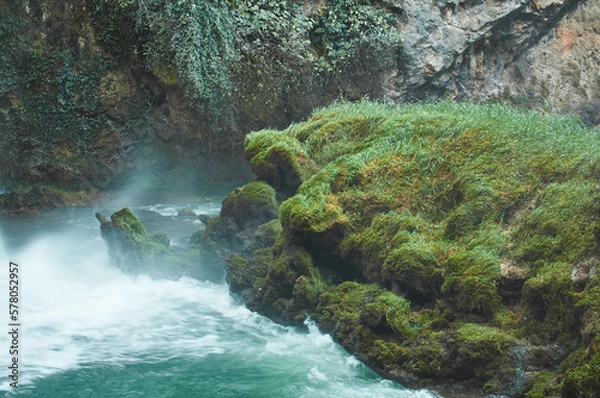 Obraz Waterfall surrounded by lush greenery